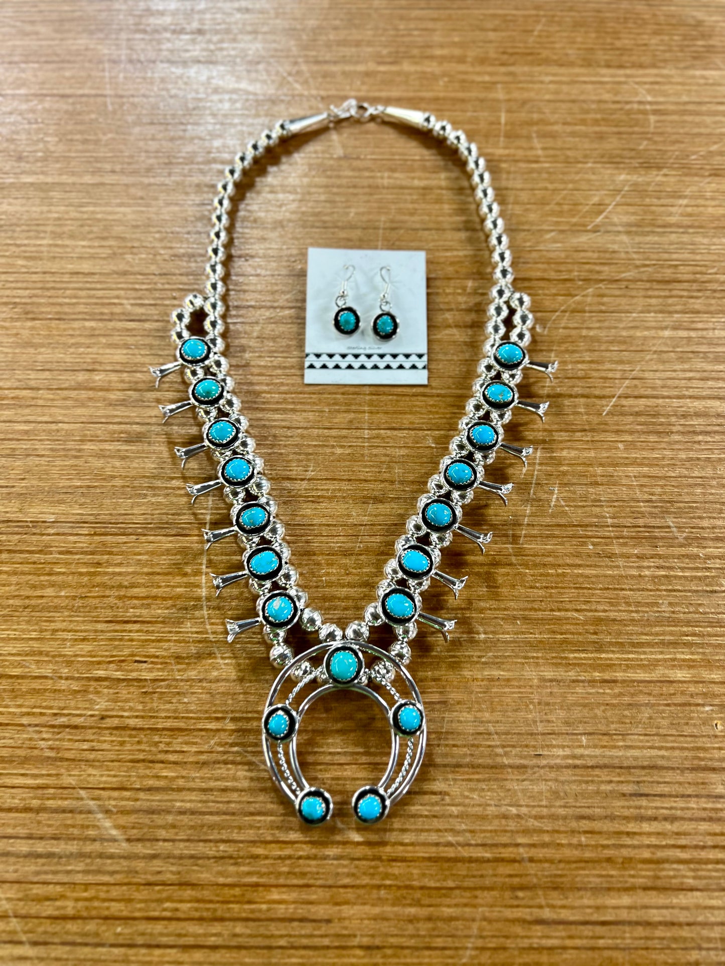 The Trudy Genuine Turquoise Sterling Silver Squash Blossom Necklace and Earrings Set
