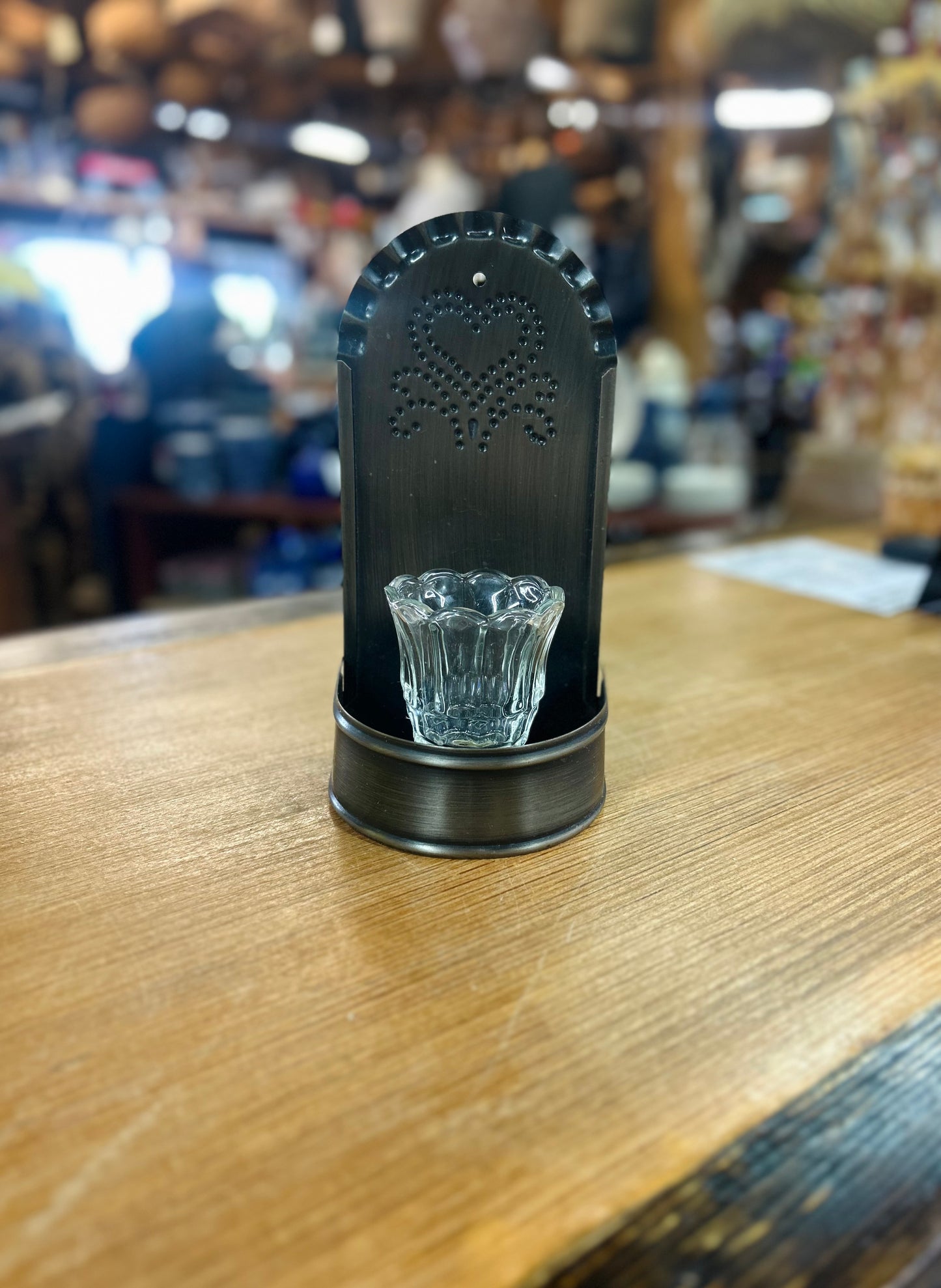 Punched Tin Wall Sconce With Candle Holder Featuring a Black Finish And Heart Design