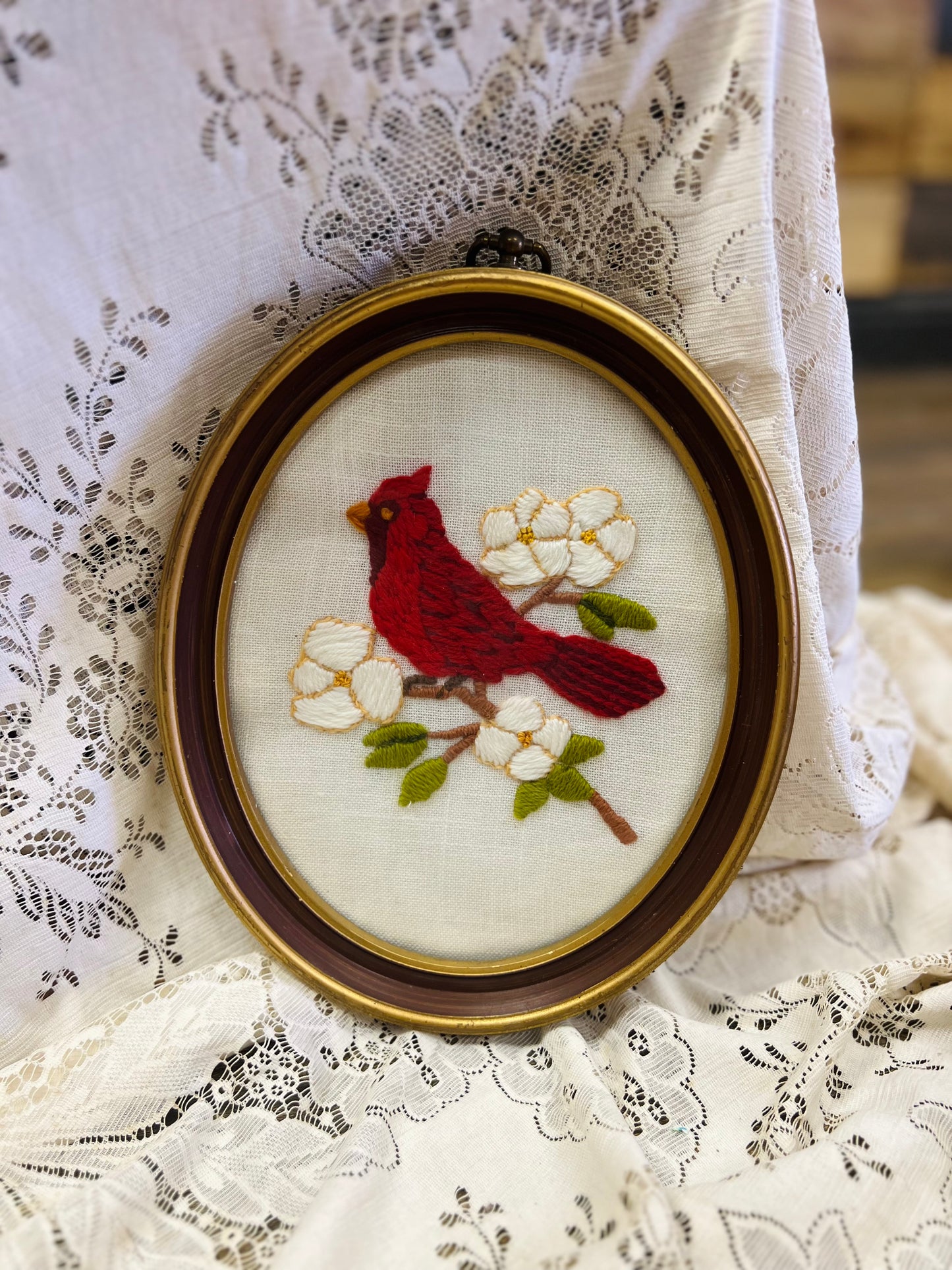 Vintage Embroidery Art with Red Cardinal Bird Resting on Branch