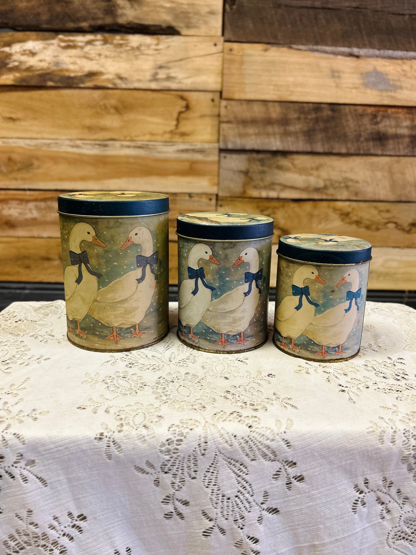 Vintage Nesting Tin Canisters With White Geese With Blue Bow Design