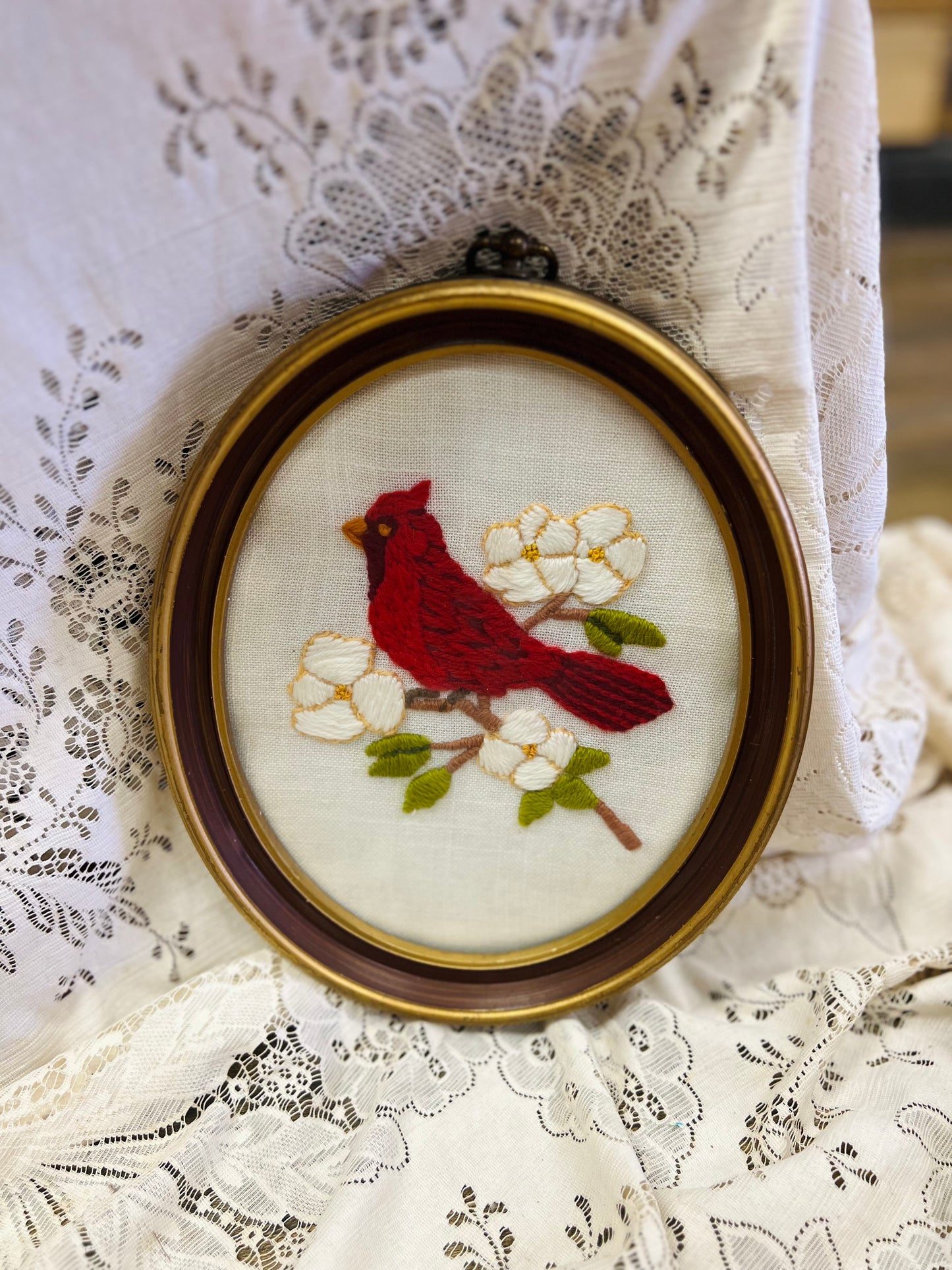 Vintage Embroidery Art with Red Cardinal Bird Resting on Branch