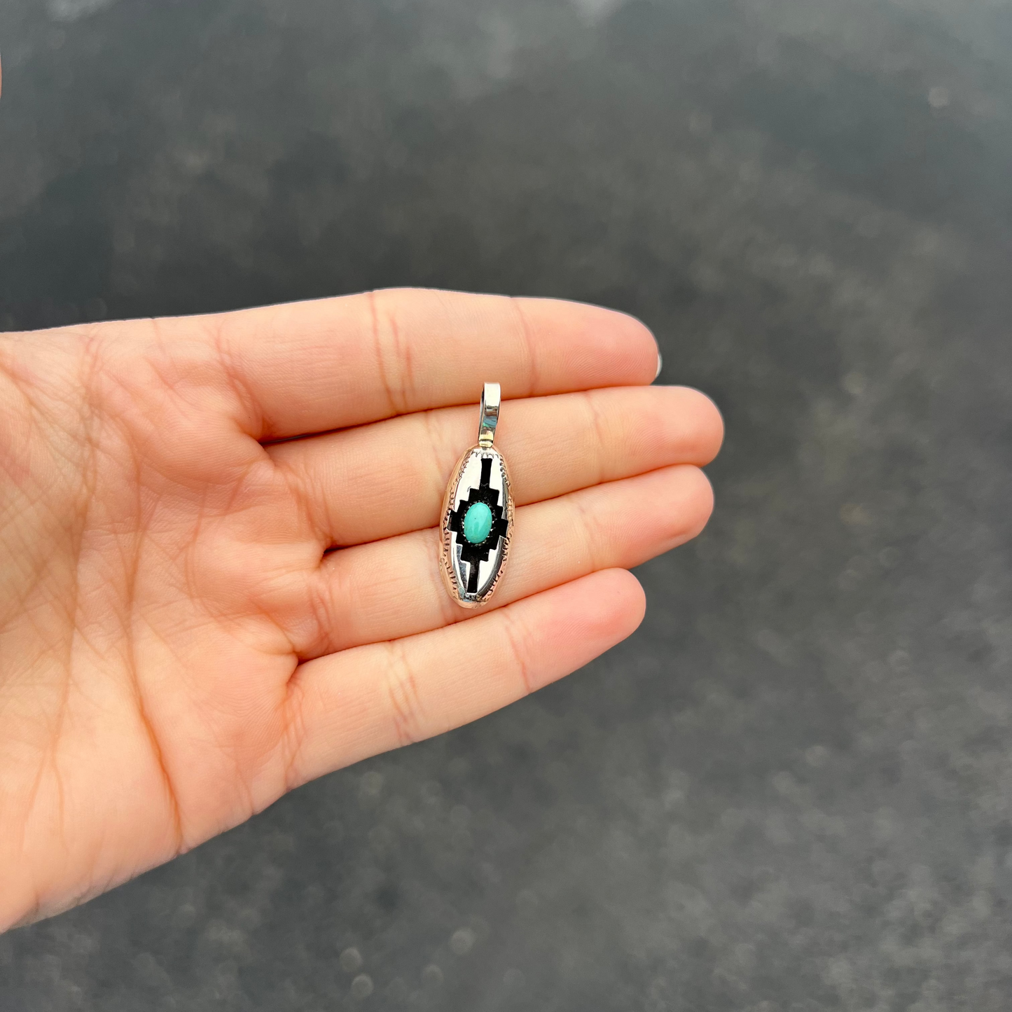 The Wynonna Genuine Turquoise Oval Aztec Shadowbox Sterling Silver Pendant