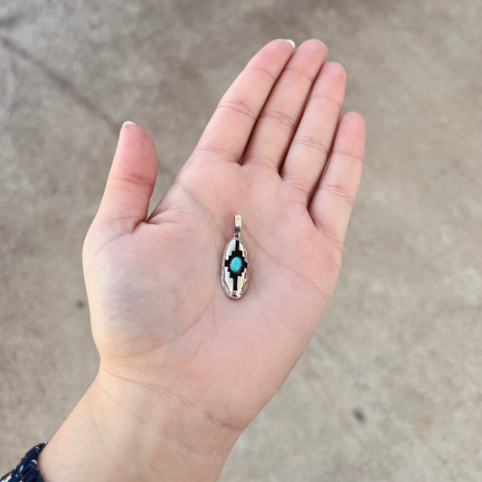 The Wynonna Genuine Turquoise Oval Aztec Shadowbox Sterling Silver Pendant